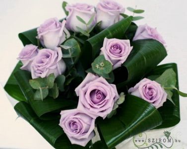 10 purple roses in a round bouquet