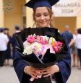 Graduation bouquet with unicorn, fluffy pink flowers - original product photo with AI background