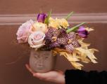 Head pot with windblown flower hair, in the theme of color of the year Mocha Mousse