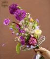 Airy bouquet of wildflowers with English roses, in a woolen cord bouquet base