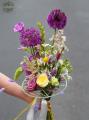 Airy bouquet of wildflowers with English roses, in a woolen cord bouquet base