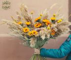 Modern bouquet with sunflowers and dried grasses