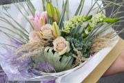 Natural bouquet with furry echeveria, roses, lilies