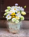 Summer flowers and eustomas in tin bowl