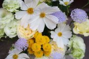 Summer flowers and eustomas in tin bowl
