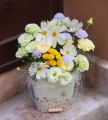 Summer flowers and eustomas in tin bowl