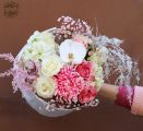 Pink and white fluffy bouquet with orchid, round paper wrapping