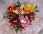 Small heart box with colorful orchids, berries