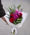 Small red rose bouquet with mokara orchid - original product photo with AI background