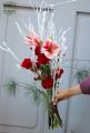 winter bouquet with amaryllis and red roses