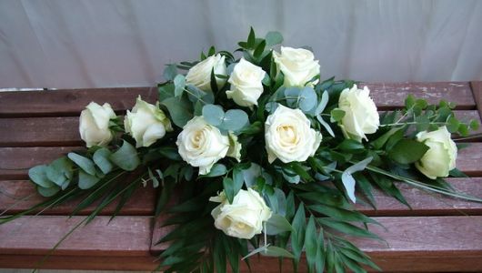 medium size bier arrangement with white roses and eucalyptuses (60 cm)