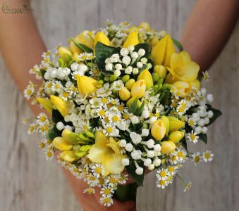 Bridal bouquet with yellow freesias, chamomilles, bouvardias and tulips