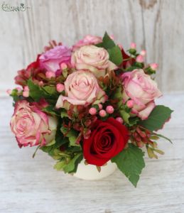 Ceramic pot with 9 peach purple color roses, and berries