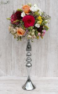 Centerpiece on silver base candlestick (rose, english rose, buttercup, fresia, wild flowers, peach, pink, claret, white, sárga)