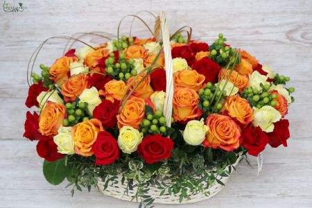 60 warm color roses with green berries in basket