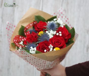 Small red rose bouquet with eryngiums, craspedias, bouquet paper with hearts