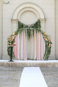 round wedding gate with ribbons and white-orange flower arrangement (rose, dahlia, gladiolus)