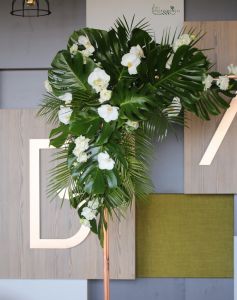 white wedding gate flower arrangement (phalaenopsis, lisianthus, white)