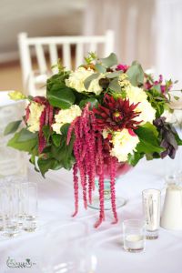 Lush wedding table decoration in chalice (lisianthus, dahlia, pomegranate, cream, burgundy)