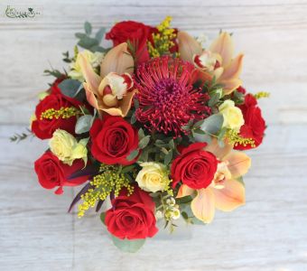 Wedding table decoration in glass cube (rose, orchid, protea, red, peach)