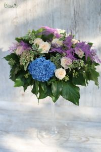 High wedding table decoration in a vase (hydrangea, asparagus, spray rose, peach, purple, blue)