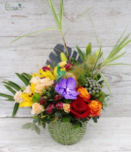 Jungle flower arrangement with metallic palm leaf