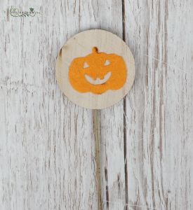 Happy pumpkin figure on stick