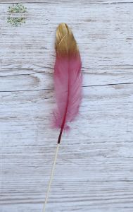 Pink/gold bird feather on stick