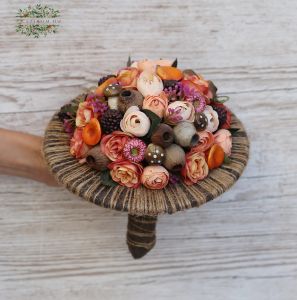 Autumn bouquet with artificial flowers and fruits