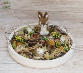 Spring arrangement in wooden bowl with bunny