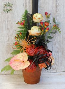 Rusty pot with rusty bee, tropical flowers and roses