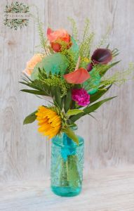 Turquoise vase with summer flowers and seashells