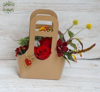 Red rose bag bouquet with interesting flowers , orchids
