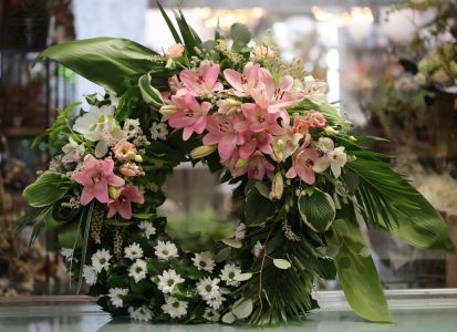 Ivy wreath decorated on two spots, with aisiatic lilies and orchids 70-100cm