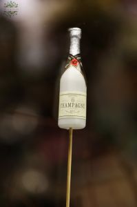 champagne figure on stick