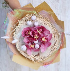 Orchid bouquet with shiny apples