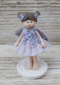 ceramic little girl in purple dress