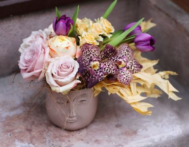 Head pot with windblown flower hair, in the theme of color of the year Mocha Mousse