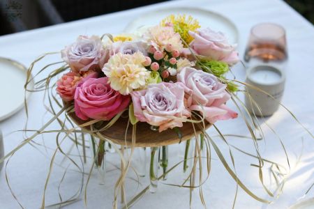 Modern wedding and event table decoration with pastel roses (lavender purple, pink, light yellow, rose, English rose, carnation, leucospermum)