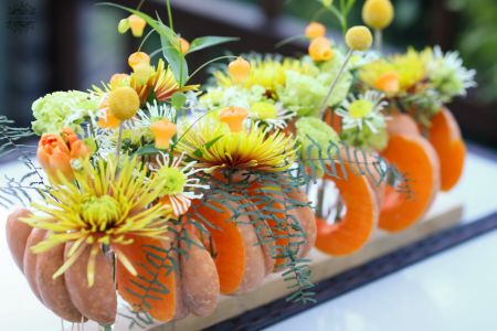 Modern wedding table decoration, event table decoration, autumn, made of pumpkins (chrysanthemum, sandersonia, lisianthus,  yellow, green)