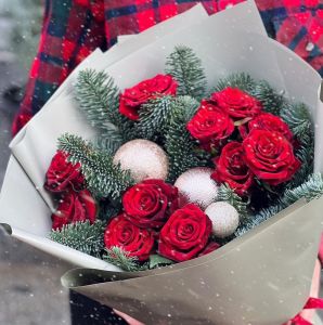 Red rose bouquet with Christmas tree decorations