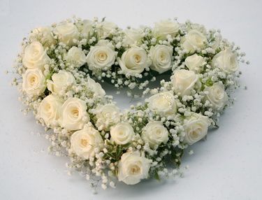 heart shape with 30 white roses and baby's breath