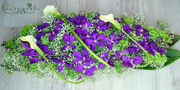 Main table centerpiece with mokara orchids (baby's breathe, calas, molusella, purple), wedding