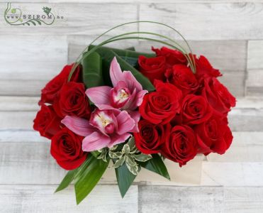 Modern arrangement in wooden box from red roses andpink orchids (22 stems)