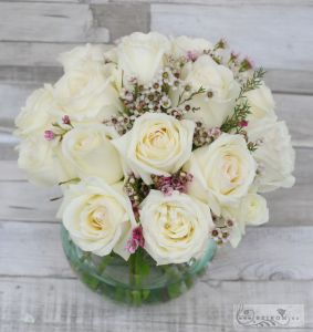 White roses with waxflowers in glass ball centerpiece, wedding