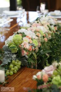 Main table centerpiece in vineyard, Haraszthy Vallejo Pincészet (rose, hydrangea, carnation, wild flowers, grape, peach, white, green), wedding