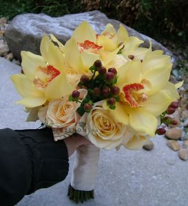 Bridal bouquet with yellow orchids, cream roses (hypericum,peach) 