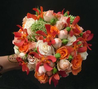 Bridal bouquet with spider orchids (rose, sedum, orange, peach)