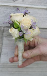 Boutonniere of spray rose and lavander (purple, peach)