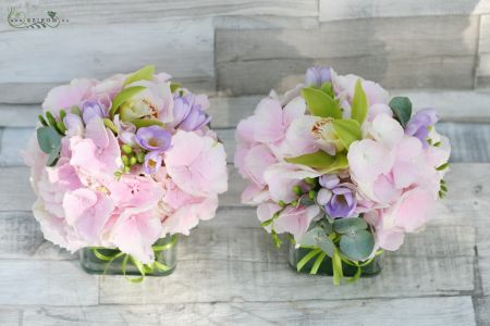 Flower arrangement in a glass cube (hydrangea, freesia, orchid, pink, purple, green) Városliget Caffé Restaurant, Budapest, wedding